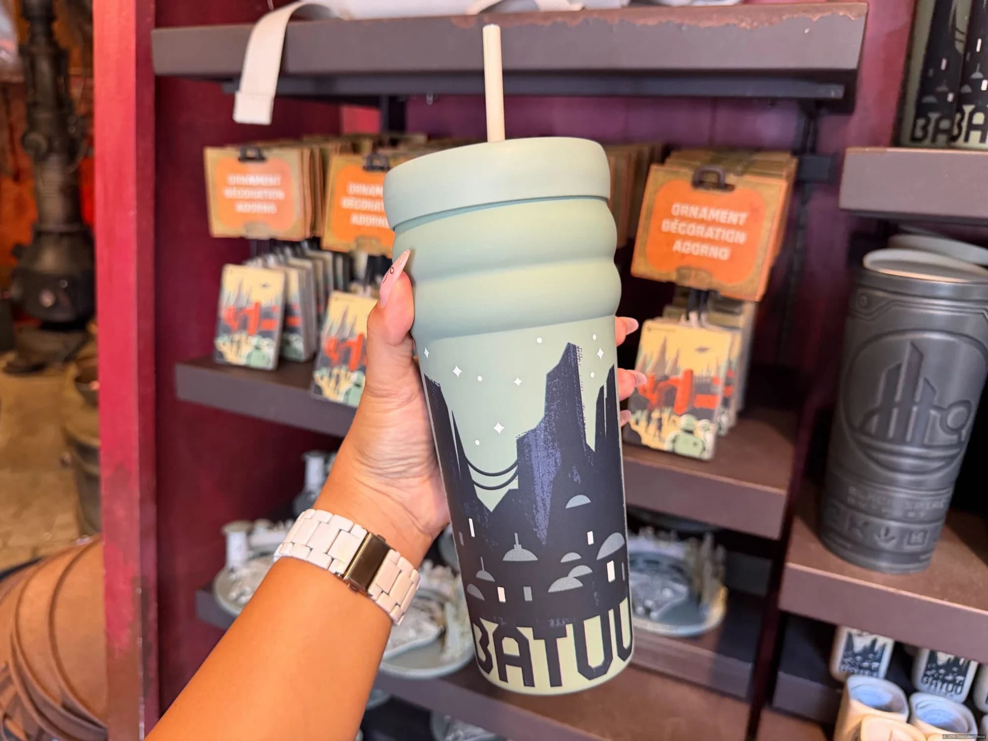 Star Wars merchandise display featuring apparel, collectibles and drinkware at Disney World's Galaxy's Edge themed area