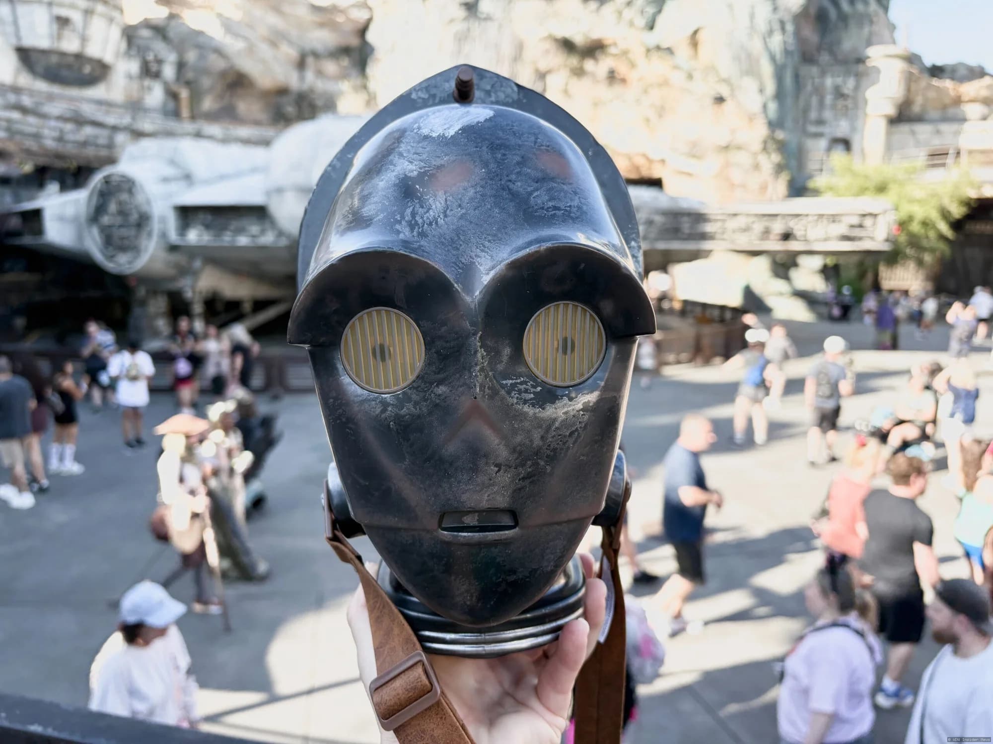A novelty merchandise bucket designed to resemble a Star Wars Protocol Droid, displayed at Walt Disney World
