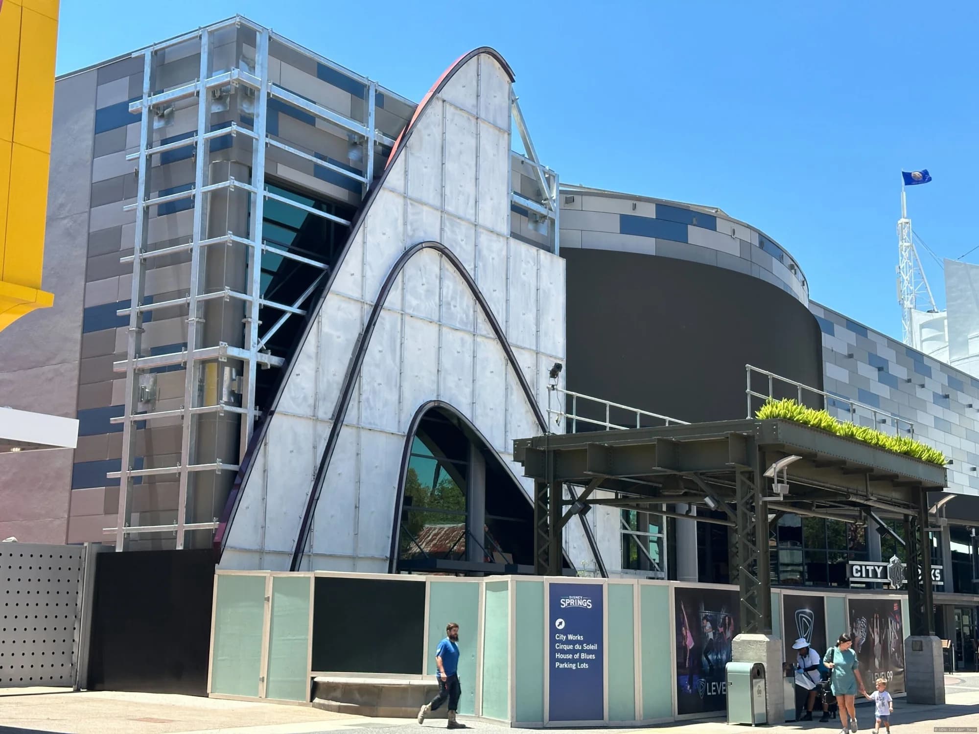 Construction of the Level99 building at Disney Springs with exterior panels being installed on the façade