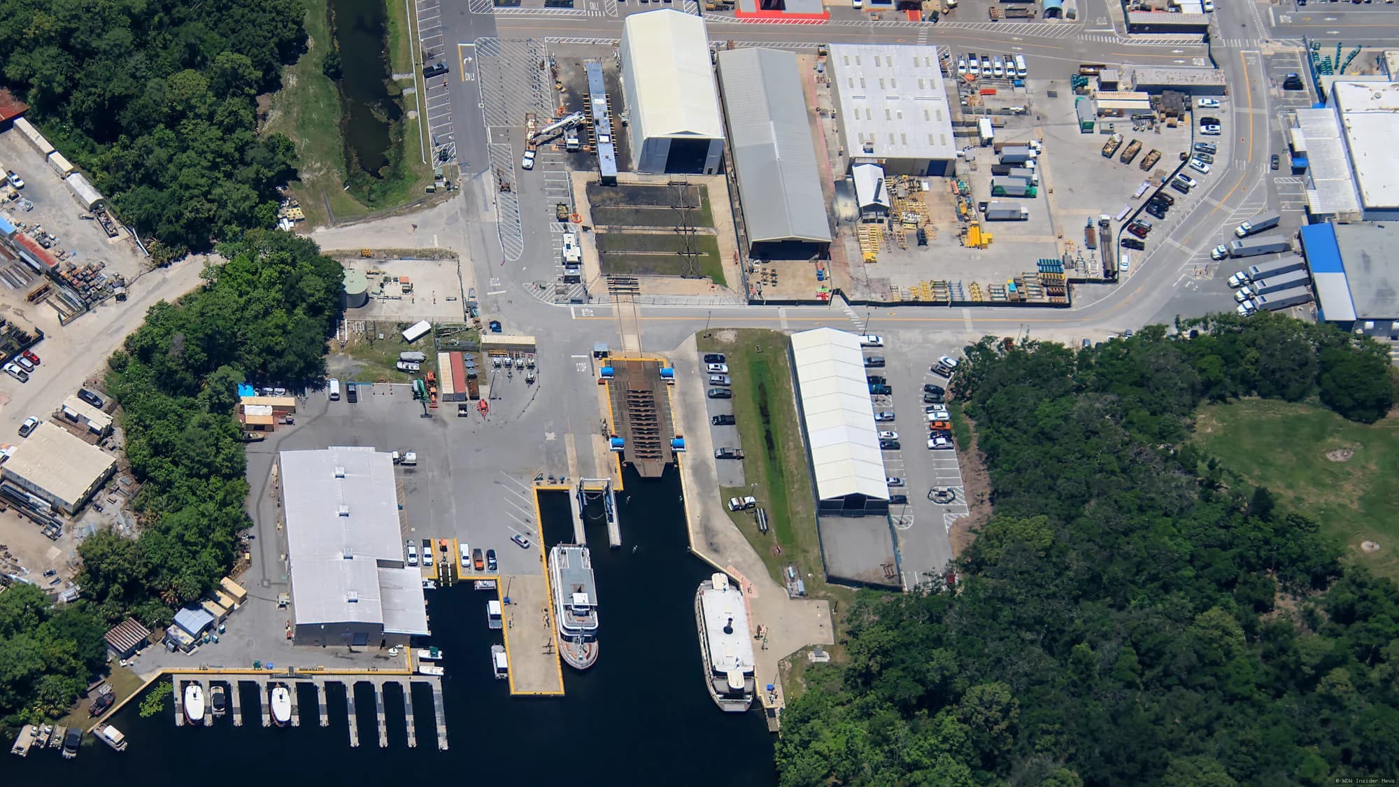 Wooden ferryboat under construction in a backstage workshop area at Walt Disney World