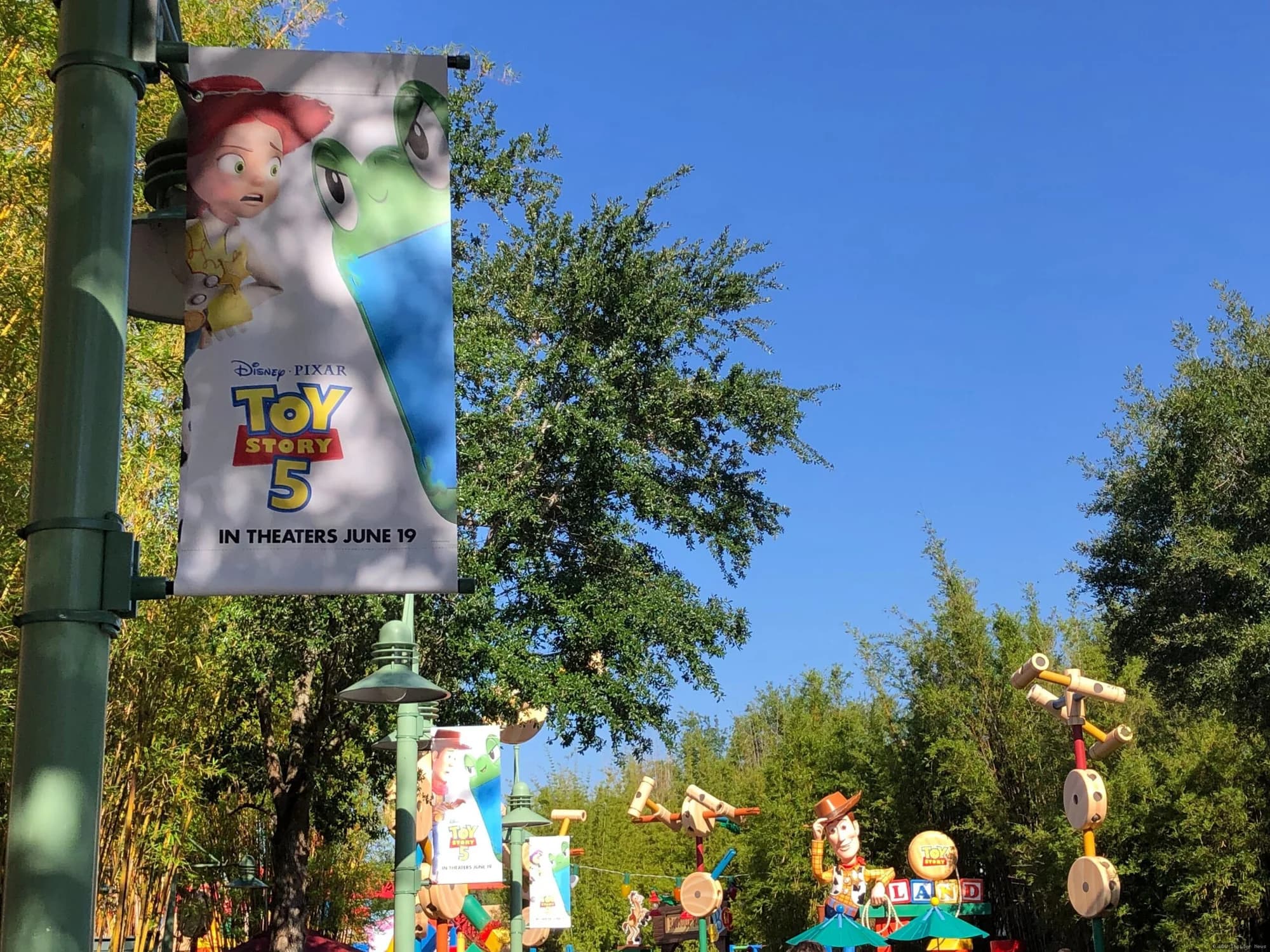Colourful Toy Story 5 promotional banners hanging at Disney's Hollywood Studios theme park
