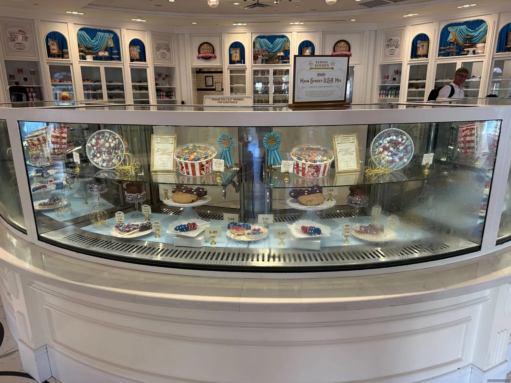 Patriotic red, white and blue confectionery treats with Mickey designs displayed at Main Street Confectionery in Magic…