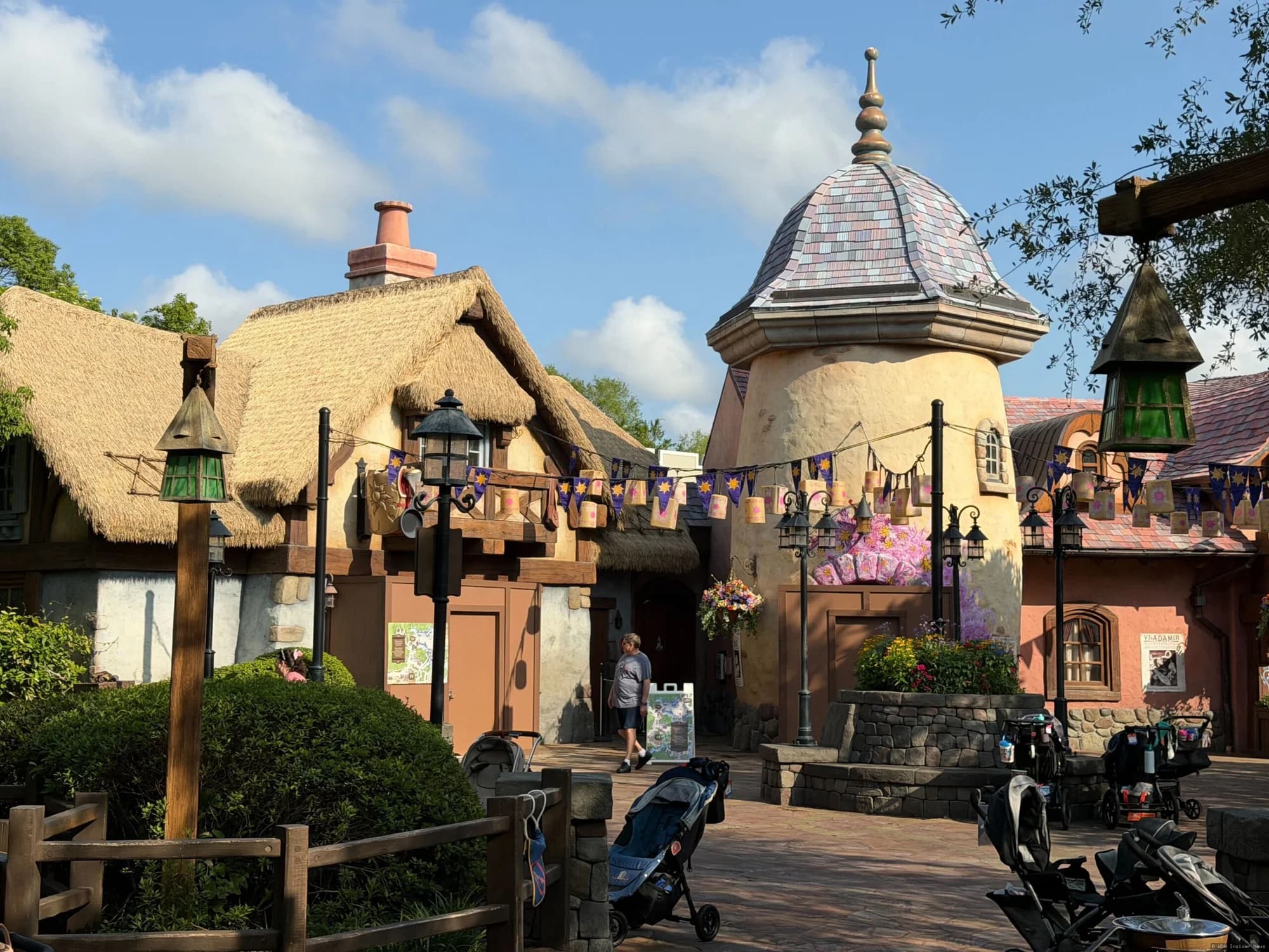 Tangled-themed restroom building at Magic Kingdom with closed signage during daytime refurbishment