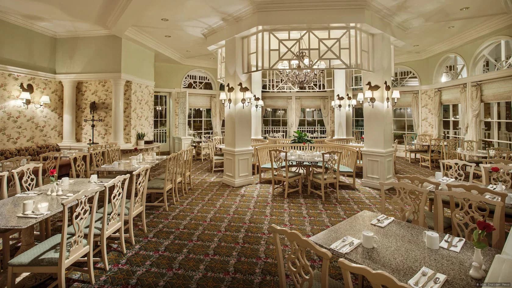 Interior of Grand Floridian Café with elegant furnishings and ambient lighting, showing the restaurant's classic décor
