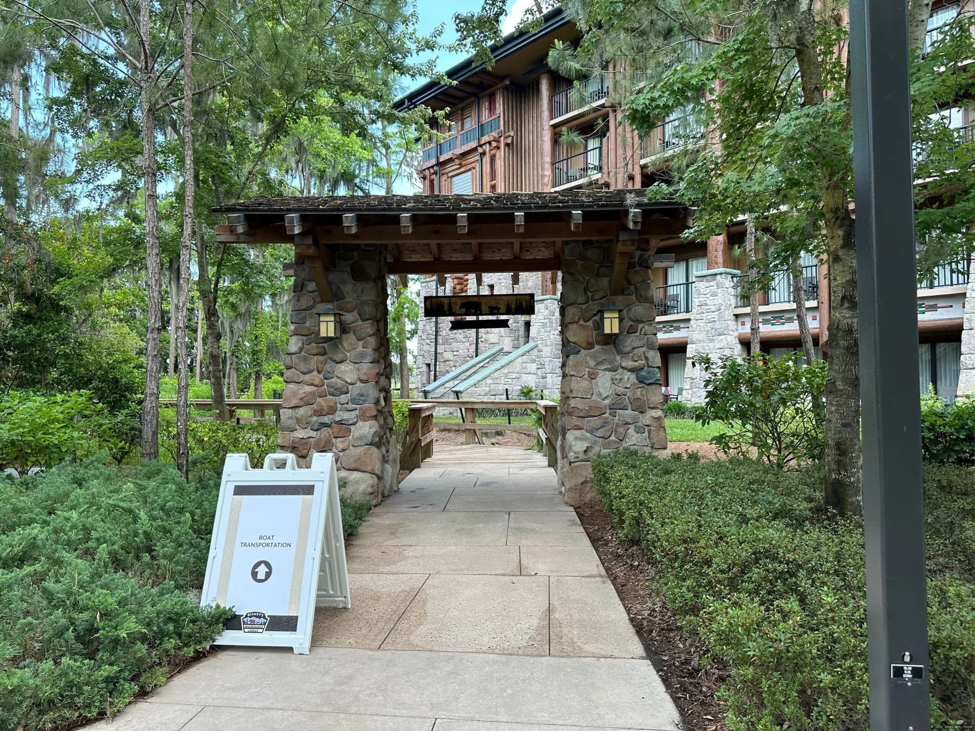 Wooden boardwalk pathway at Disney's Wilderness Lodge resort, with construction barriers indicating closure for…