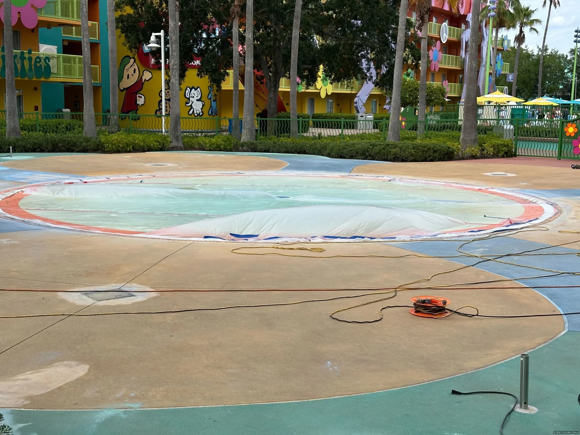 Fenced-off kiddie pool area at Disney's Pop Century Resort undergoing refurbishment works