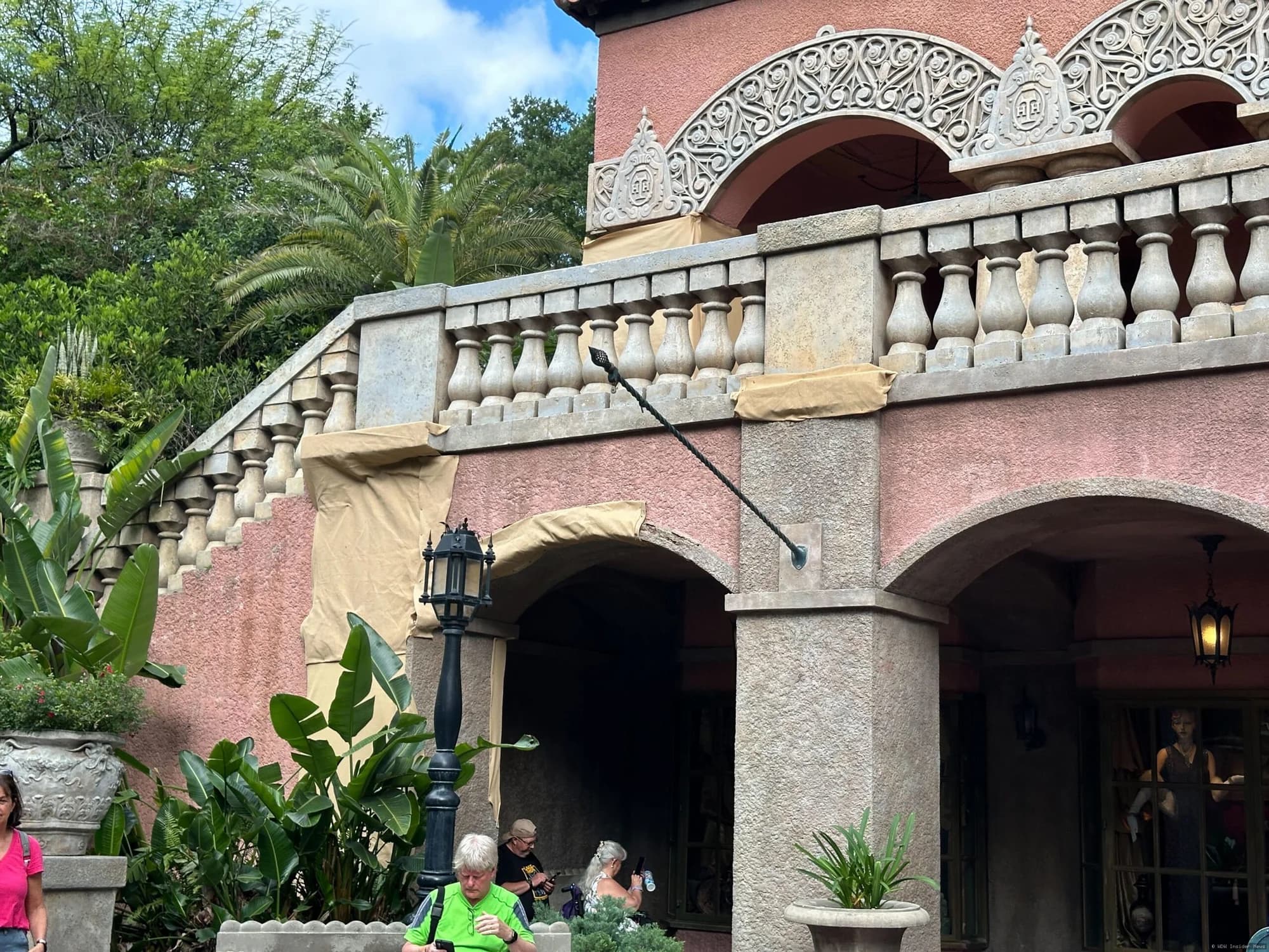 The Tower of Terror facade covered in construction scrim and scaffolding at Disney's Hollywood Studios theme park