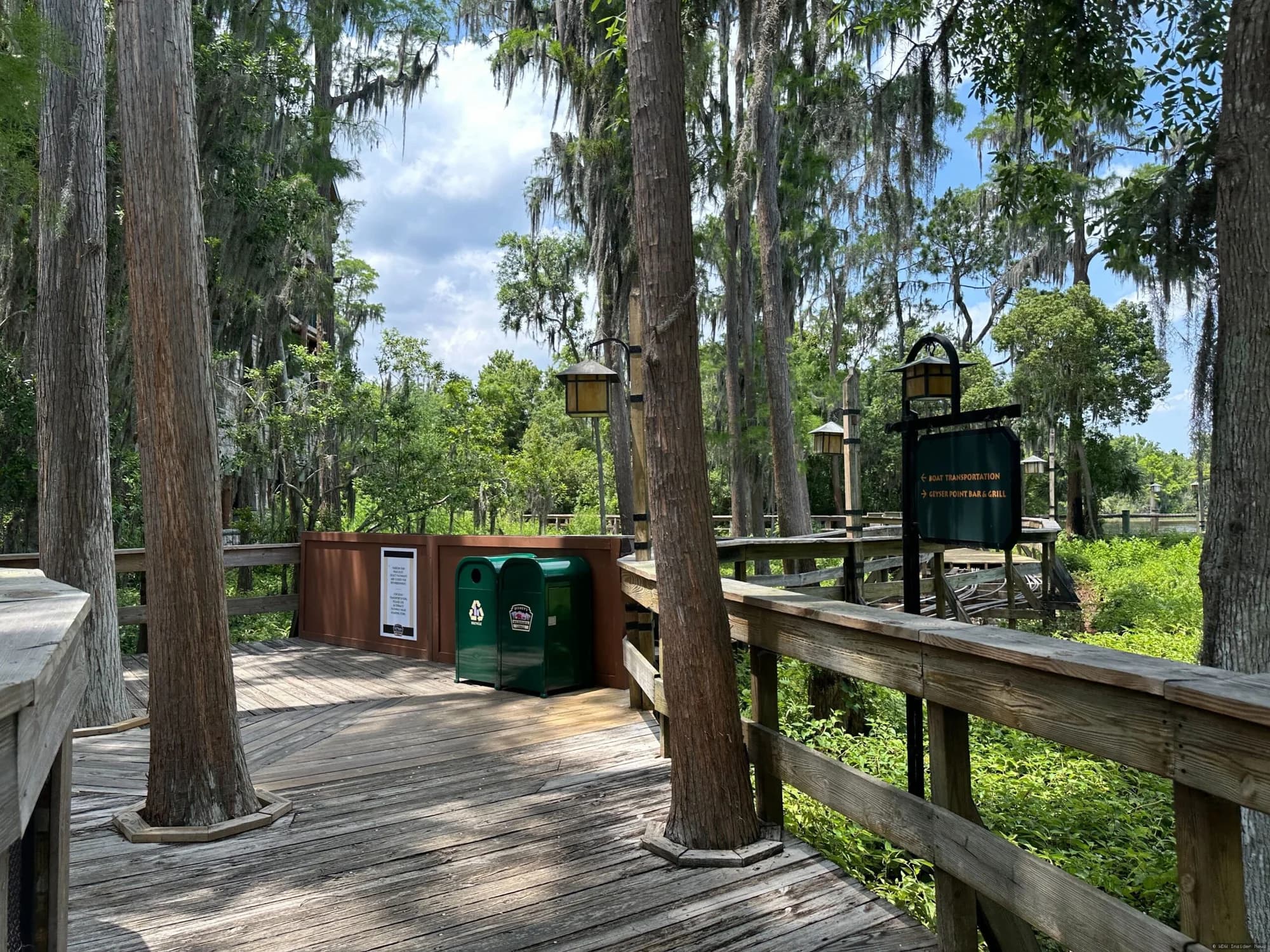 Wooden boardwalk pathway at Disney's Wilderness Lodge resort, with construction barriers indicating closure for…
