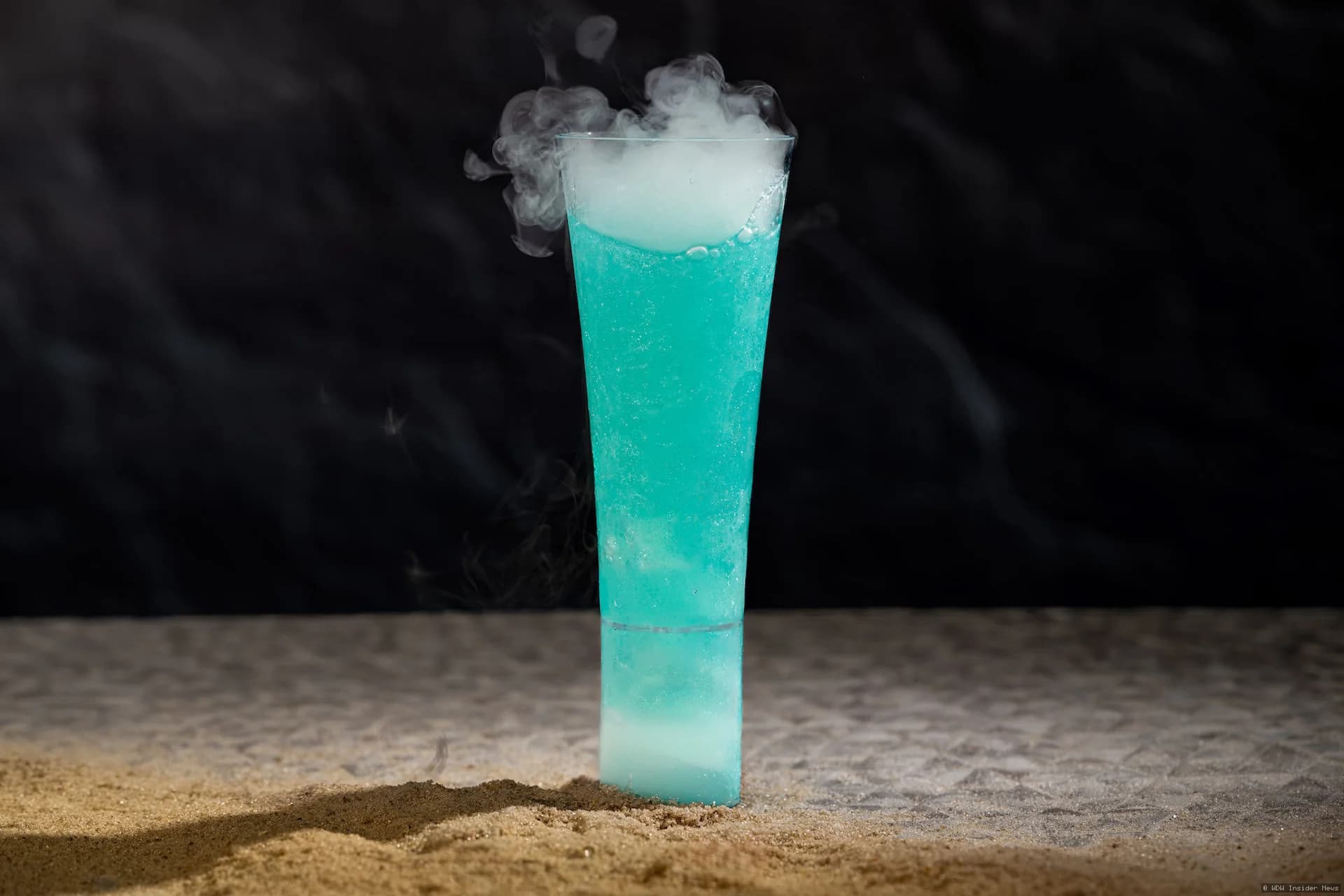 Mandalorian and Grogu themed menu items displayed at a Disney Park restaurant counter