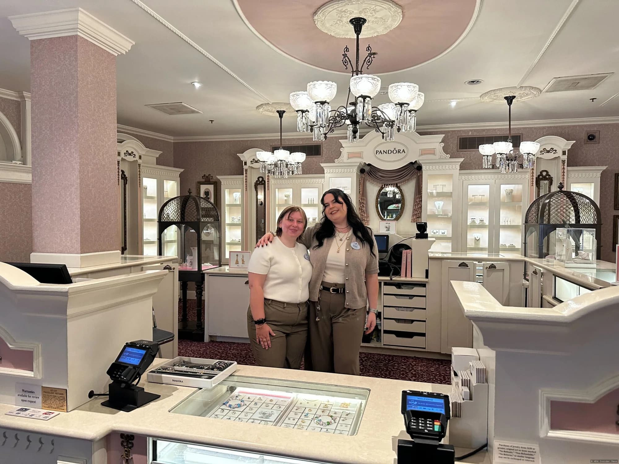 Cast members in casual modern clothing working at Uptown Jewelers shop in Magic Kingdom's Pandora land