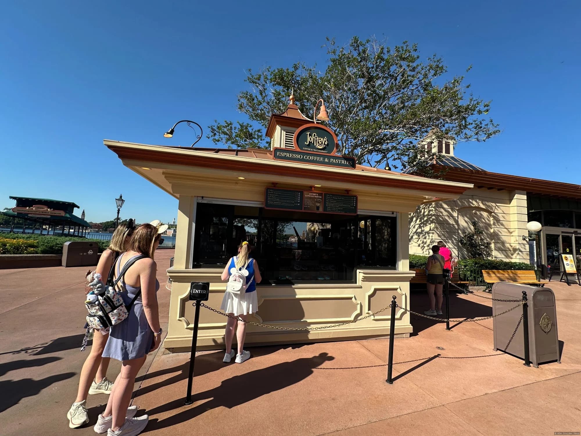 Protective mesh screens installed on the exterior of a Joffrey's coffee kiosk in EPCOT to prevent insects from entering
