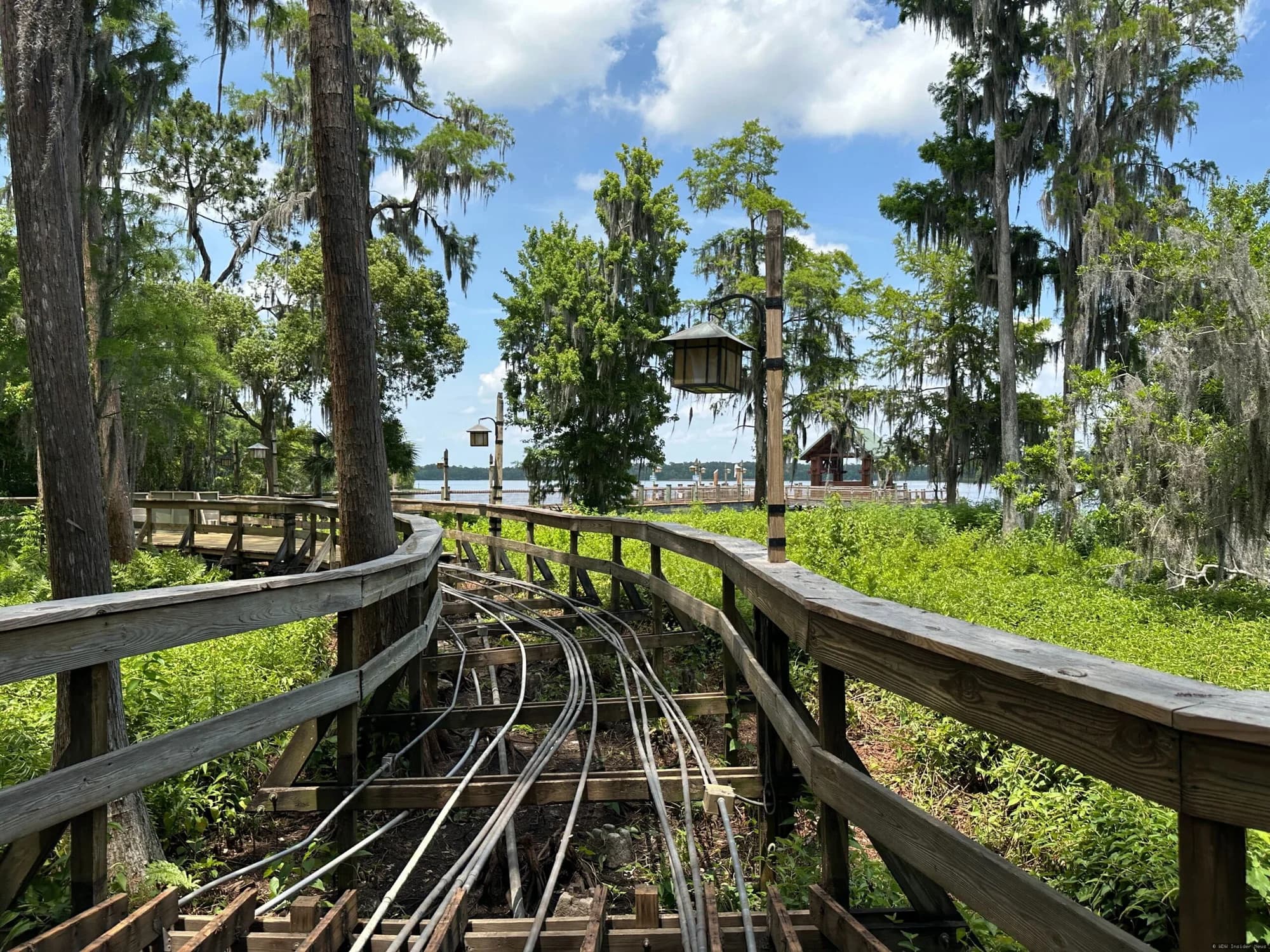 Wooden boardwalk pathway at Disney's Wilderness Lodge resort, with construction barriers indicating closure for…