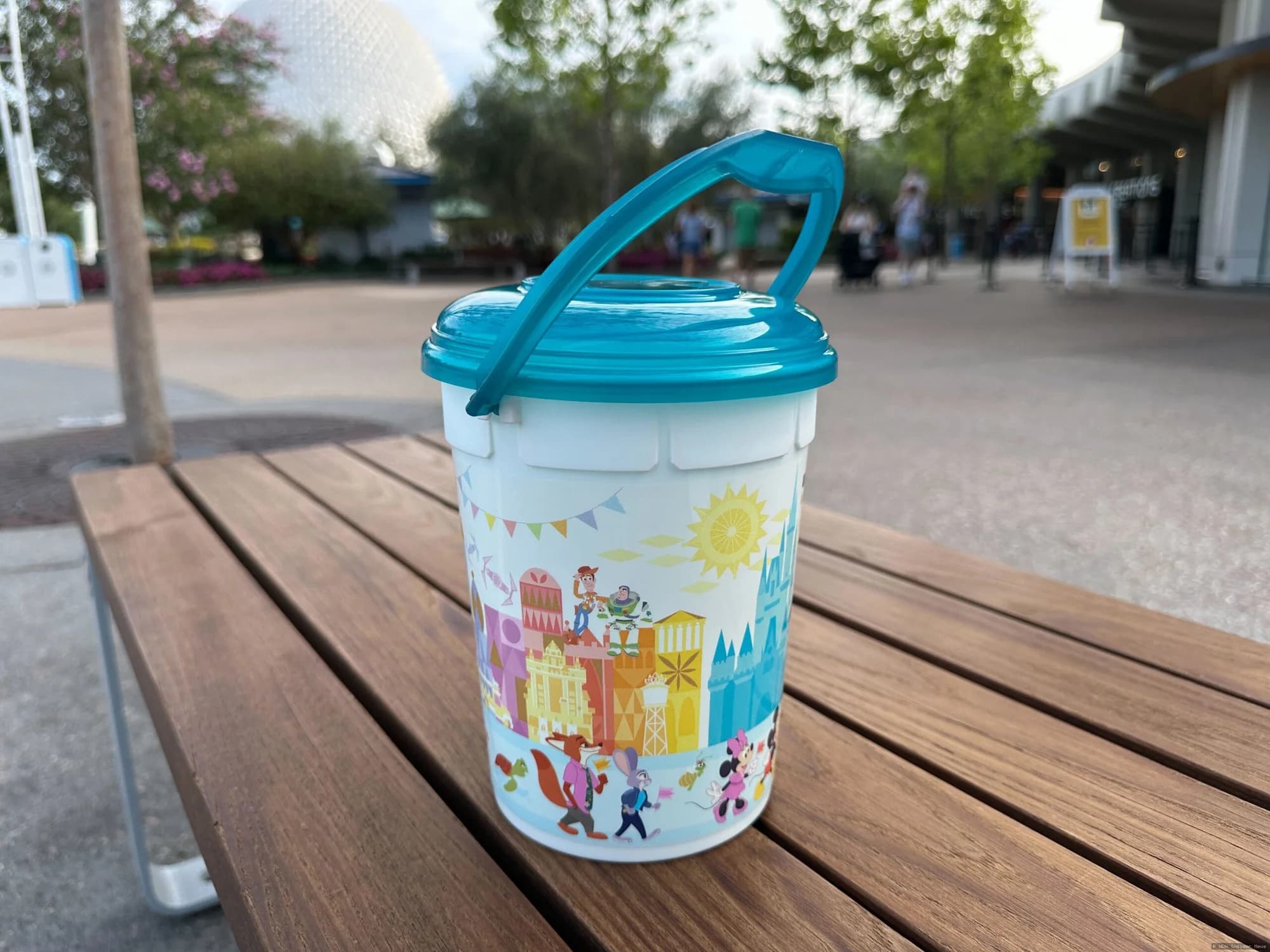 Annual Passholder popcorn bucket featuring colourful Ashley Taylor artwork displayed at Walt Disney World