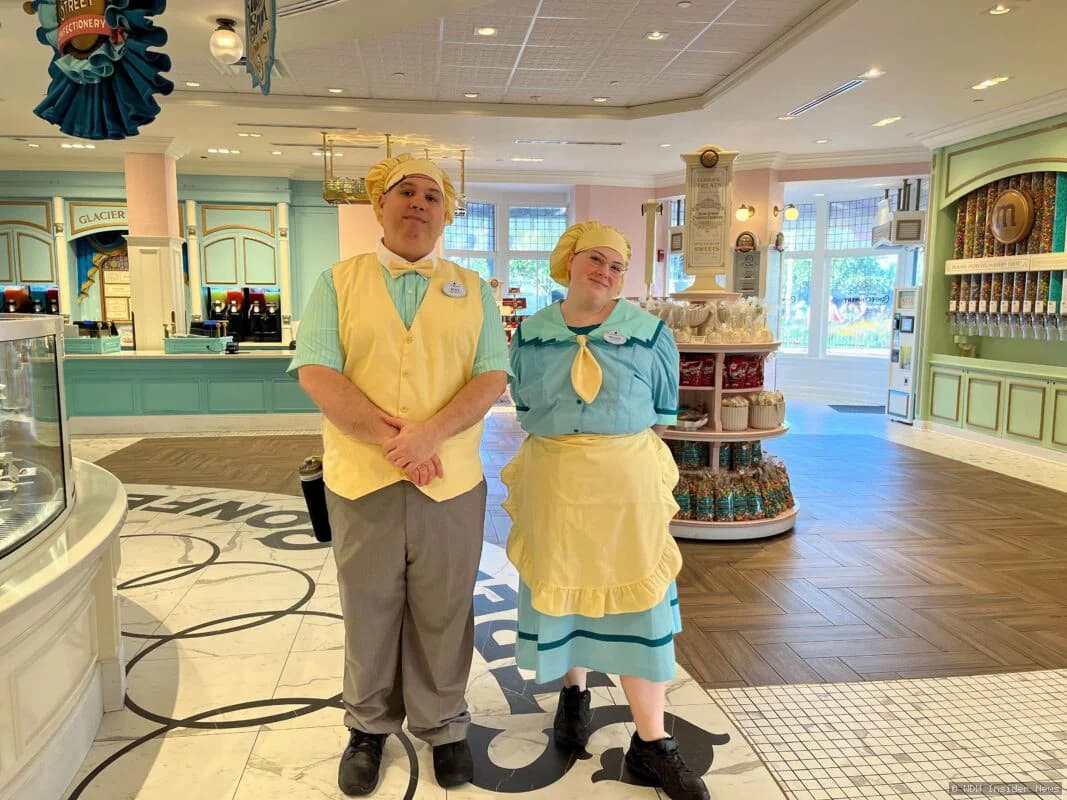 Cast members in casual modern clothing working at Uptown Jewelers shop in Magic Kingdom's Pandora land