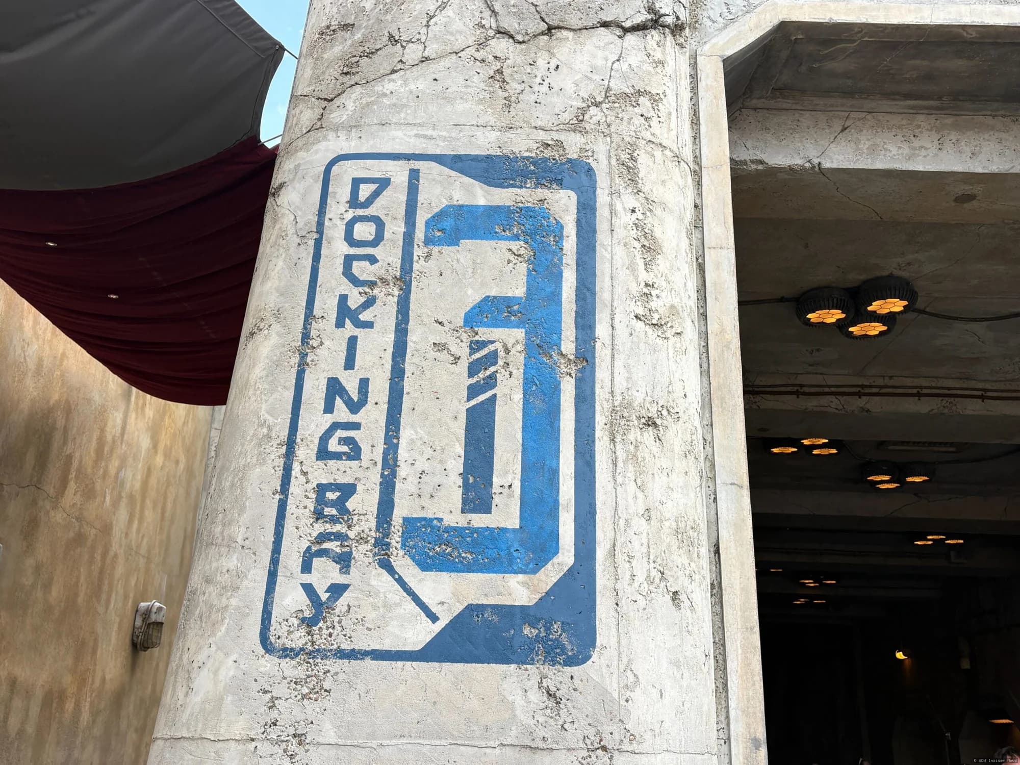 Corrected signage reading "Docking Bay 3" at Star Wars Galaxy's Edge in Disney's Hollywood Studios