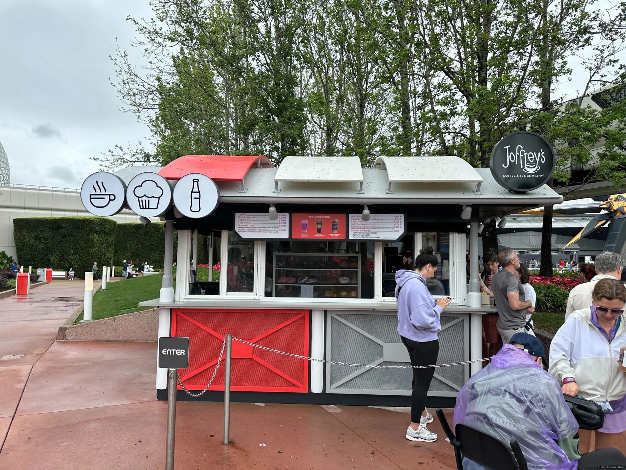 Protective mesh screens installed on the exterior of a Joffrey's coffee kiosk in EPCOT to prevent insects from entering