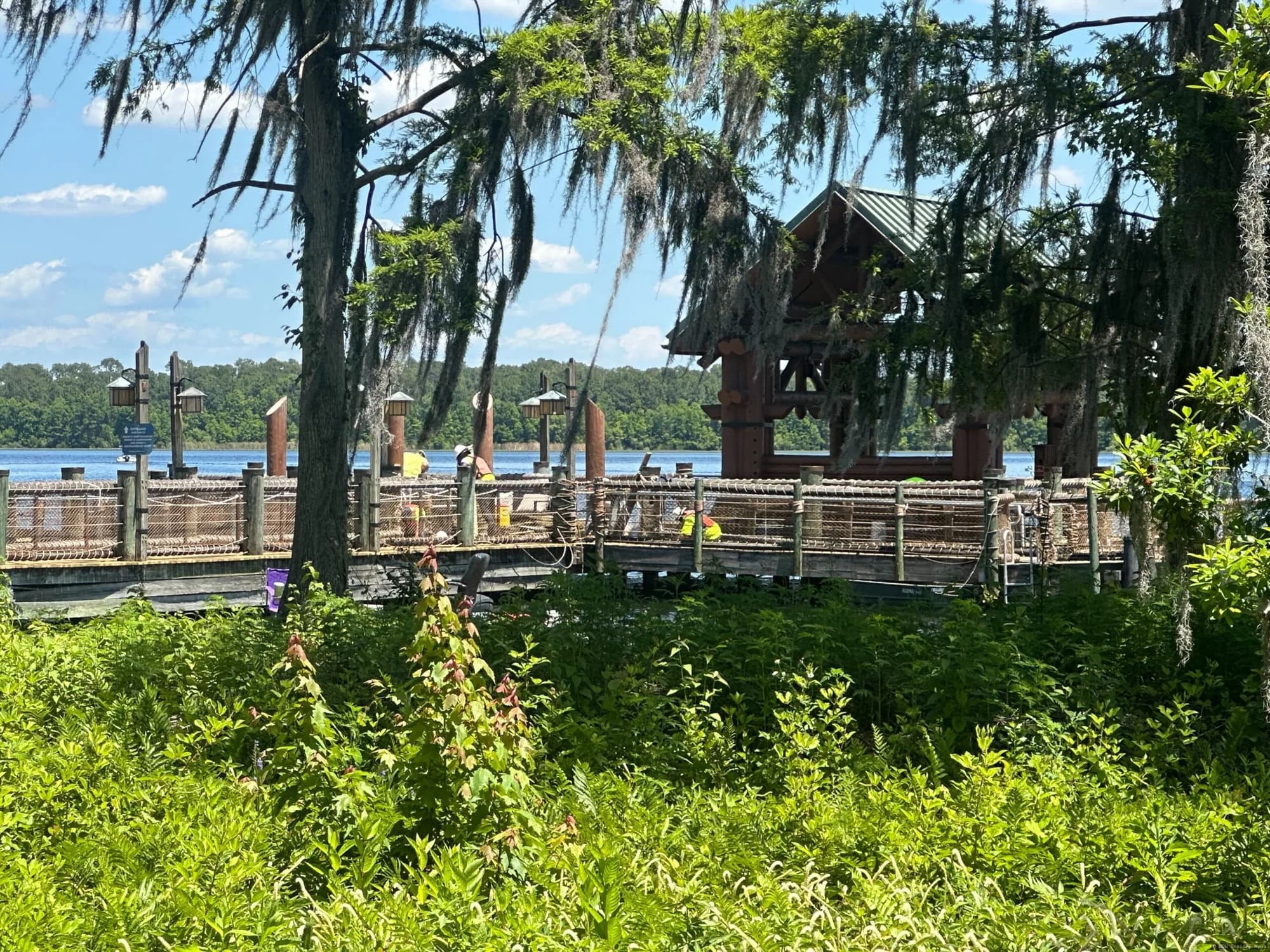 Construction barriers and equipment at Disney's Wilderness Lodge security kiosk and boat dock area