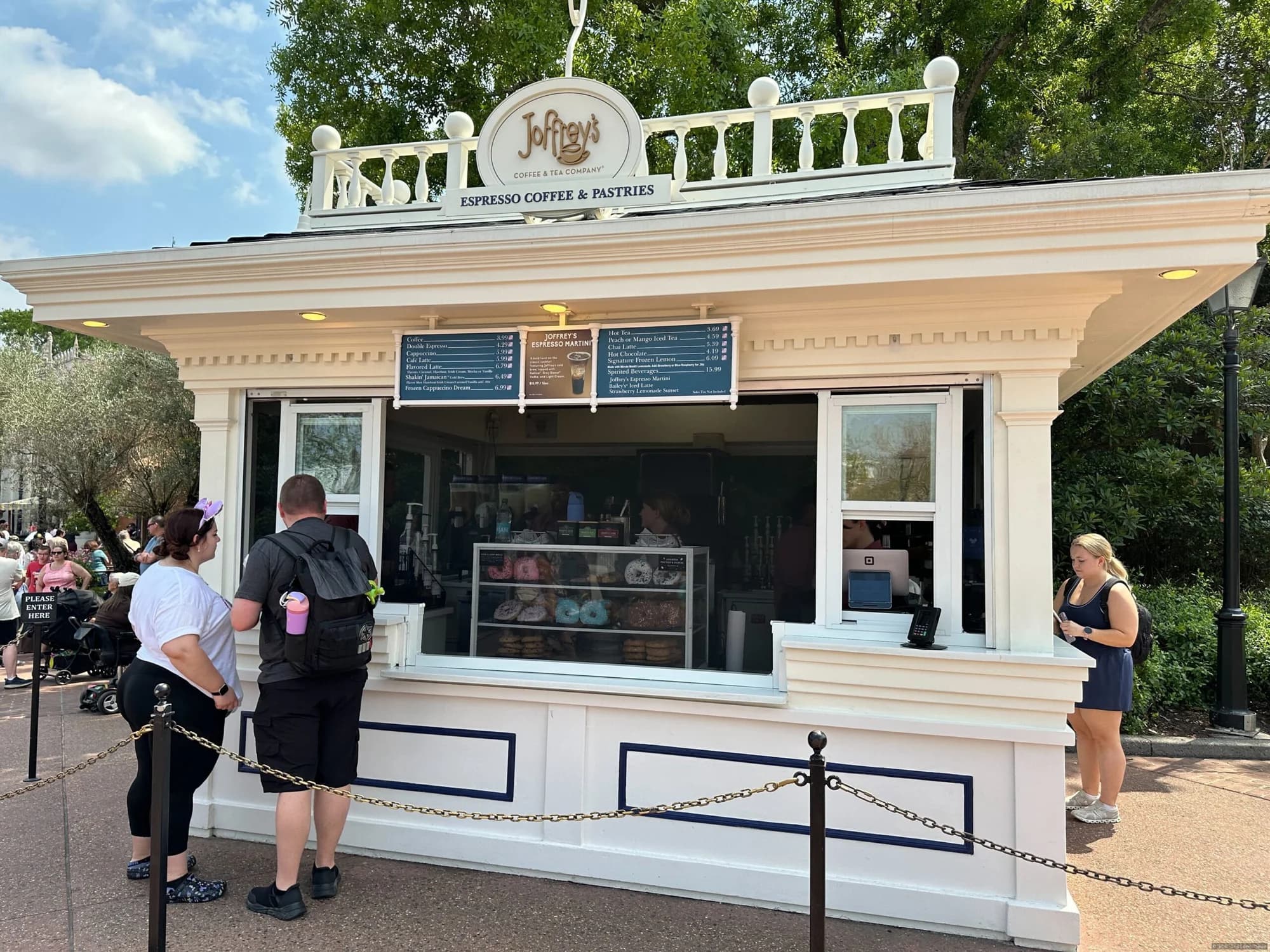 Protective mesh screens installed on the exterior of a Joffrey's coffee kiosk in EPCOT to prevent insects from entering