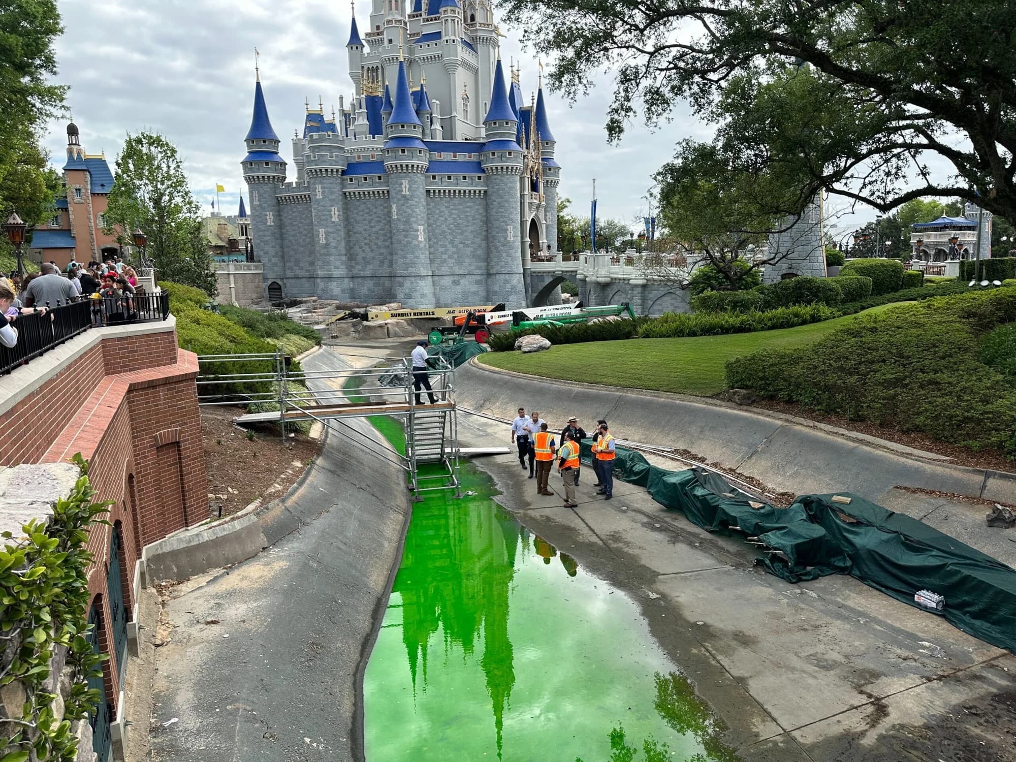 Crews Working to Remove Lime Green Water From Cinderella Castle Moat