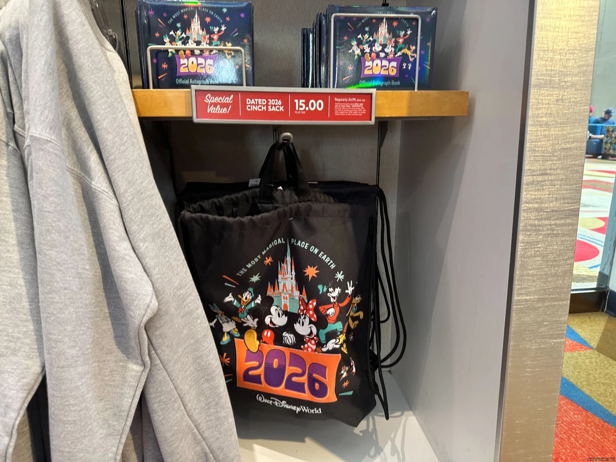 Disney merchandise displays featuring caps, bags and ornaments arranged in a Walt Disney World resort shop