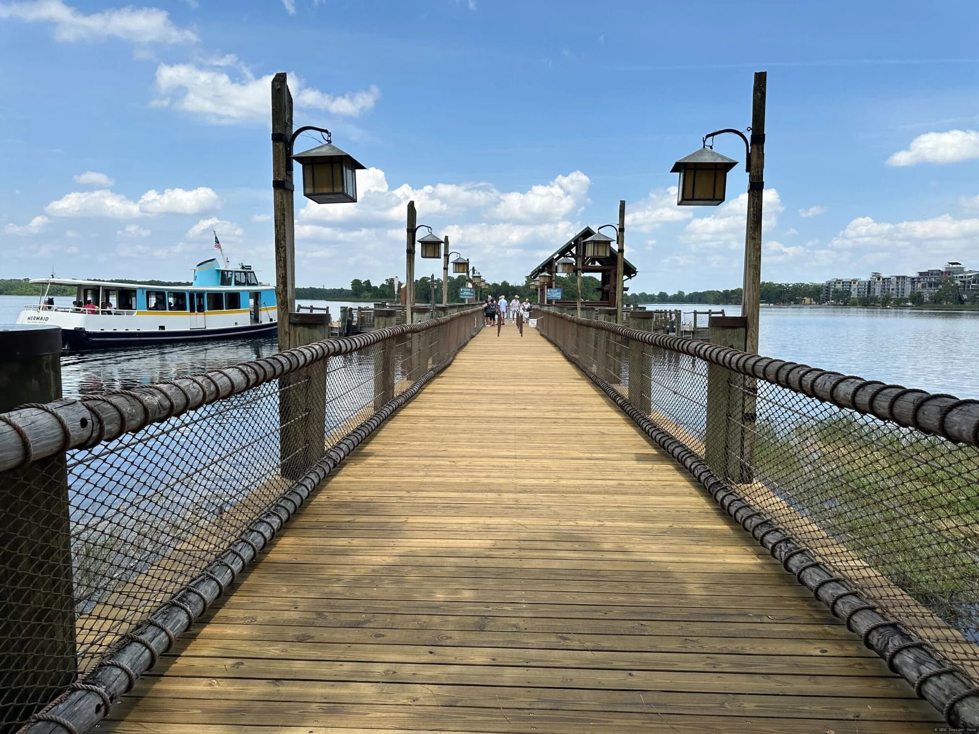 Wooden boardwalk pathway at Disney's Wilderness Lodge resort, with construction barriers indicating closure for…